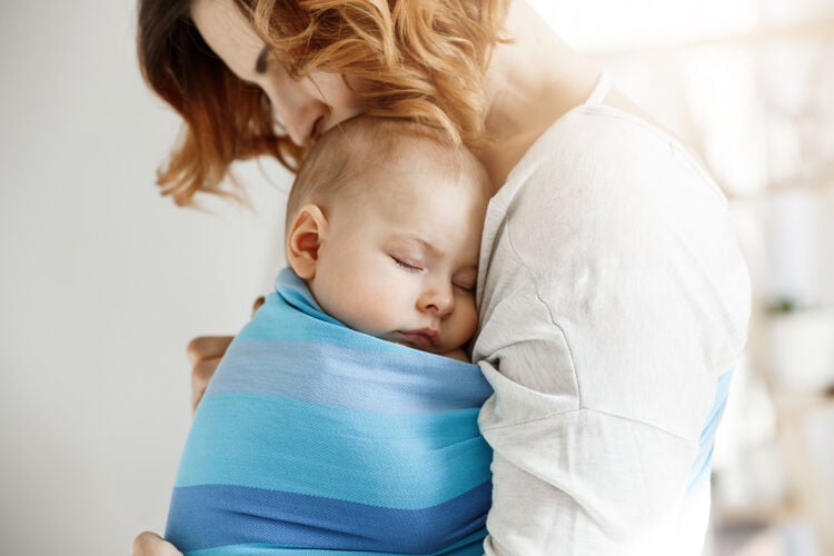 mom holding baby